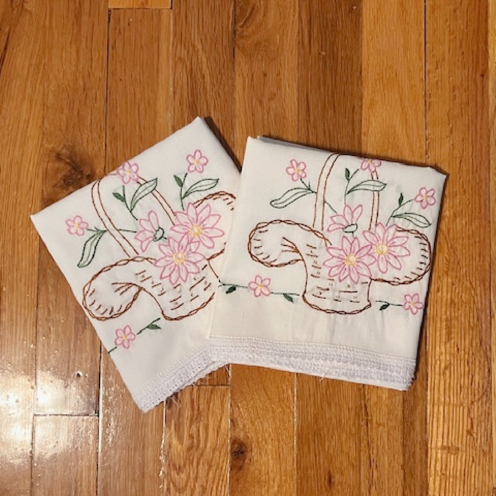 Vintage pair of pillowcases, basket and floral embroidery